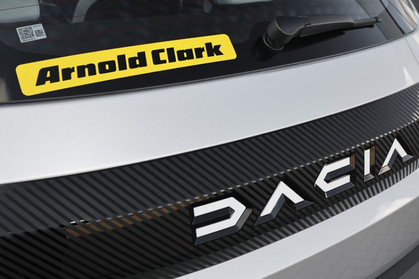 Rear view of the Dacia car badge with Arnold Clark sticker