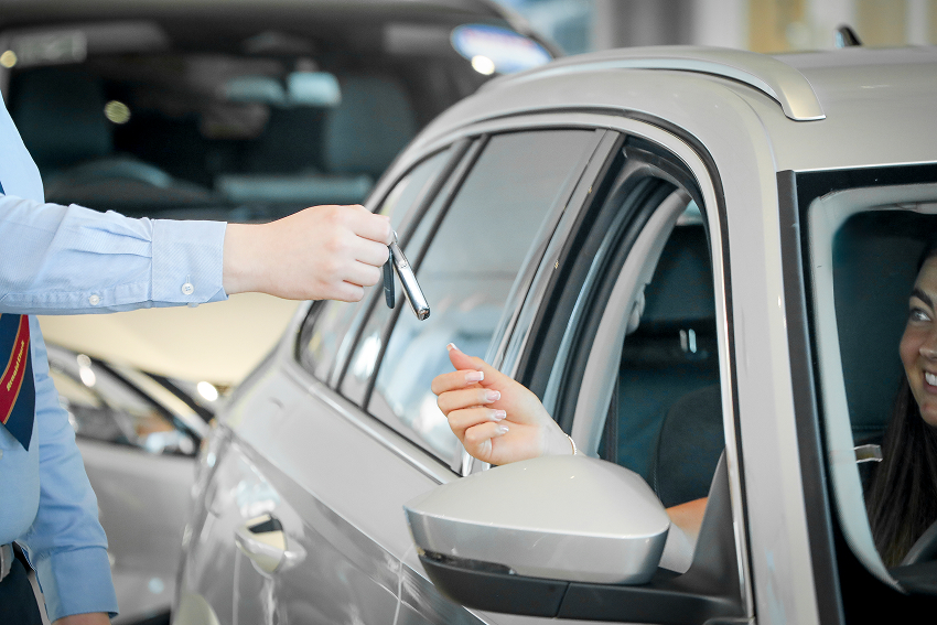 Handshake with customer in front of car