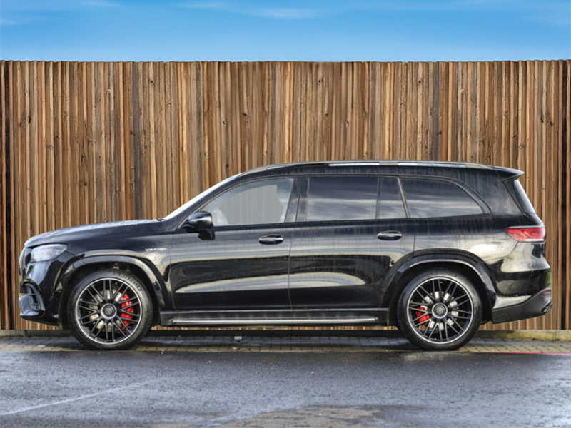 A black Mercedes-Benz GLS from the side