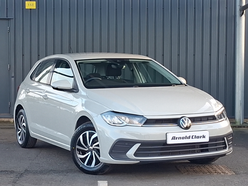white Volkswagen Polo parked from the front of a grey background