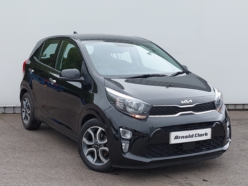 Black Kia Picanto parked in front of a grey background