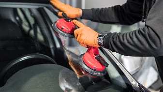 Image of technician fixing window