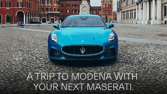 Blue Maserati Granturismo head on, trip to modena text